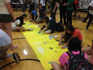 Students gather to draw