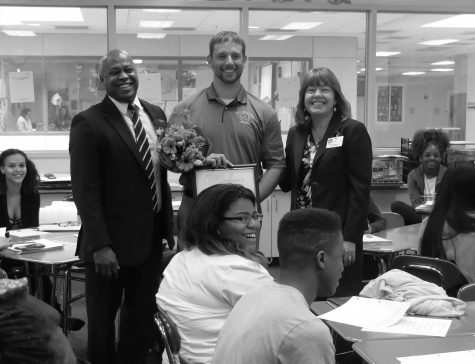 Mr. LeMon and county representatives surprise Mr. Cox with the Crystal Flame Award (Photograph by Natalie Varela).