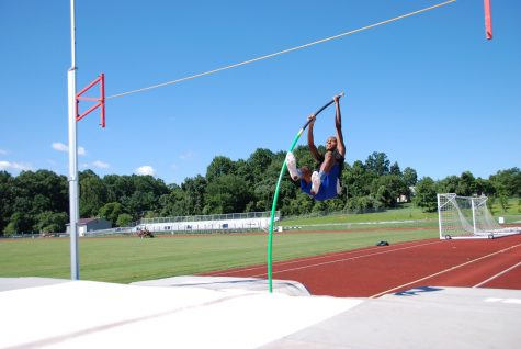 Kareem Press practices pole vaulting.