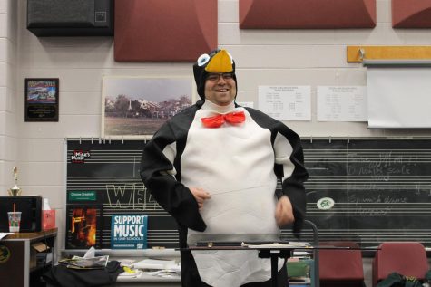Mr. Green conducting in his penguin costume.