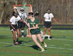 Sophomore Josie Pittman drives the ball to goal