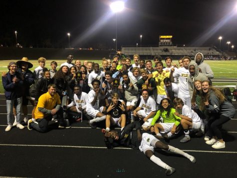 Boys and Girls soccer pose after defeating River Hill in the Regional Championship.