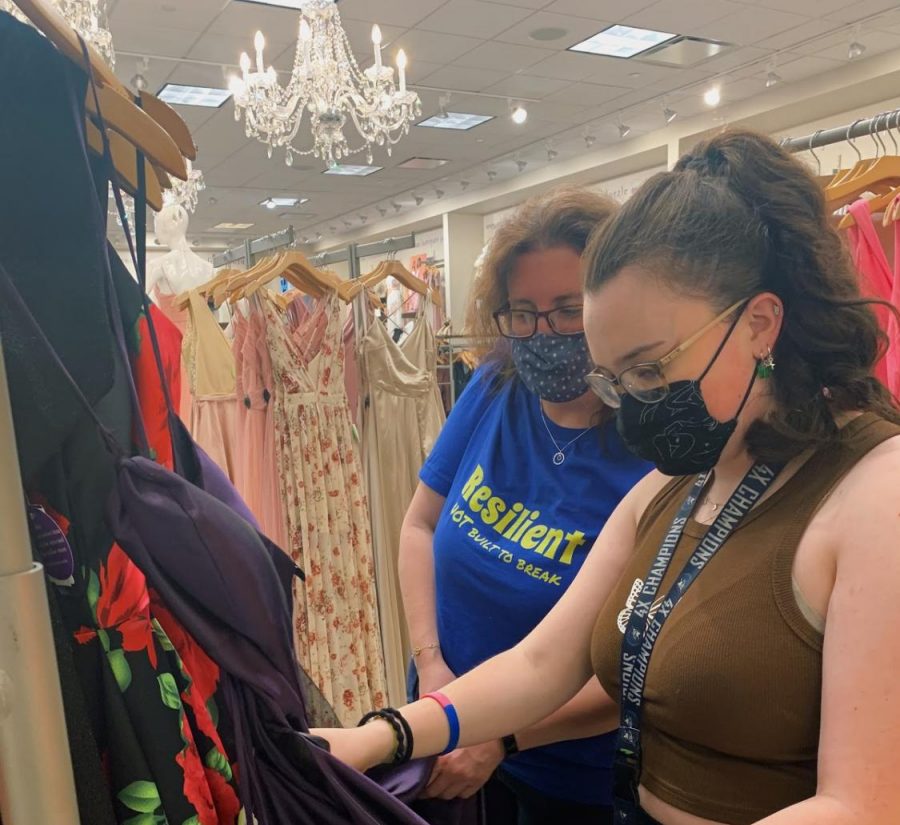 Wilde Lake student Maddy Feldwick and her mother, Rebecca Feldwick, are browsing prom dresses for Maddy’s senior prom sponsored by the Wilde Lake Class of 2021 Parent Group.
