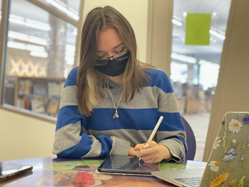 Valerie Brady, senior, studying at a Howard County library. “It can be hard, but I don’t turn in work late,” she said. “Will it be the best quality it can be? No. Will it be completed though? Yes.” (Photo by Zoe MacDiarmid)