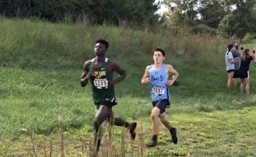 Sophomore Cross Country runner, Myles Brown (front), running a course. (Photo by Pamela Cheung).