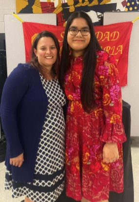 Priyal Dhringra (right) and Maria Romano-Sweitzer (left) in the Wilde Lake cafeteria on the night of the 2022 Spanish Honor Society Induction. Priyal is the Vice President of membership for the Spanish Honor Society.