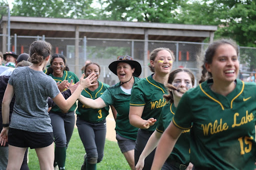 	The team celebrates the 7-5 win against Reservoir. (Photo credit Lauren Jascewsky)
