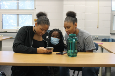 Aitya Ba’th (left), Jola Ojifinni (center), and Nalia Ba’th (right) spend time together during their Advisory period in the media center.