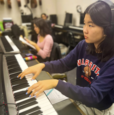 Johanna Shin perfecting an assignment for her third period class, Music Theory with Ms. Spiro. (Photo by Charlotte Fetters)