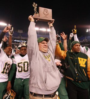 MD, DECEMBER 2, 2010 – Mr. Harrison led the football team to victory in the 2010 state championship. He is seen holding the team’s trophy high, as he celebrates their win over Franklin High with the players. COURTESY OF MR. HARRISON