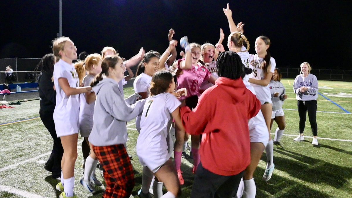 The Girls' soccer team celebrates after winning the Regional Championship game against Centennial. PHOTO COURTESY OF JESSICA MORRISSEY