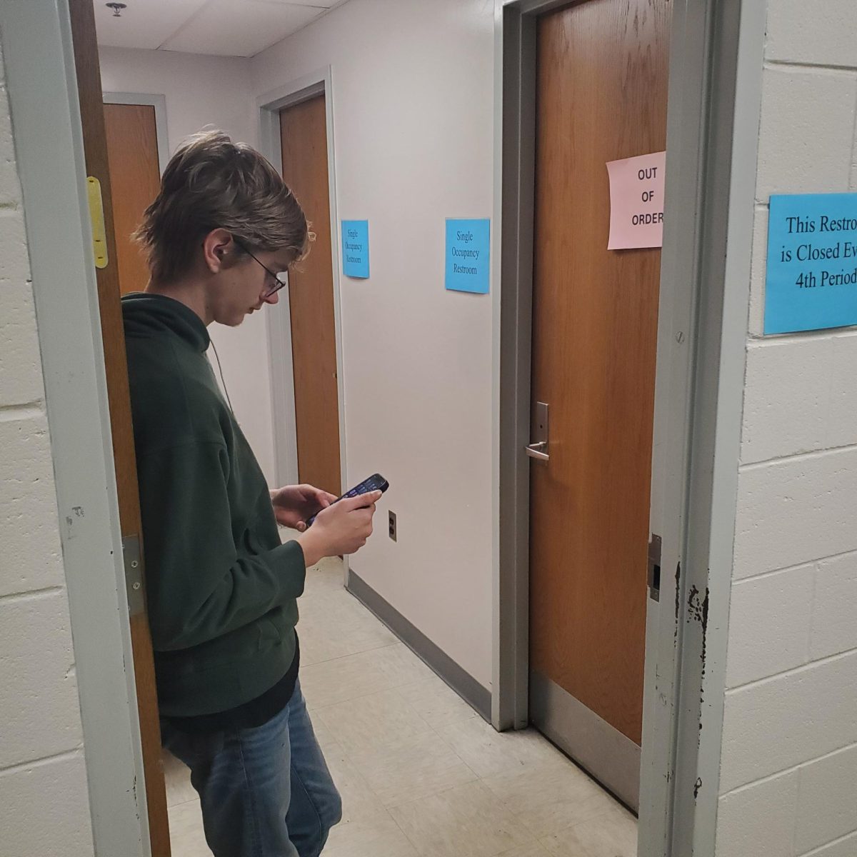 COLUMBIA, MARYLAND, FEBRUARY 25, 2025-A student waits outside the gender neutral bathroom. One of the stalls is out of order.