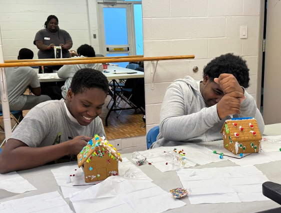 COLUMBIA, MARYLAND, DECEMBER 17, 2024 - Two HCPSS students celebrate the winter holiday during a YMCA meeting. 