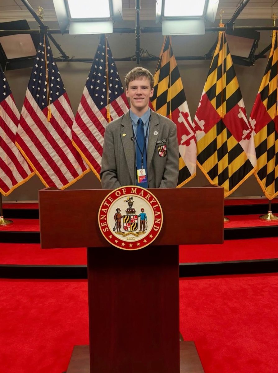 Roscoe Grader stands at a podium in the Senate press room. He worked as a House page through the MGA Student Page Program. PHOTO COURTESY OF ROSCOE GRADER