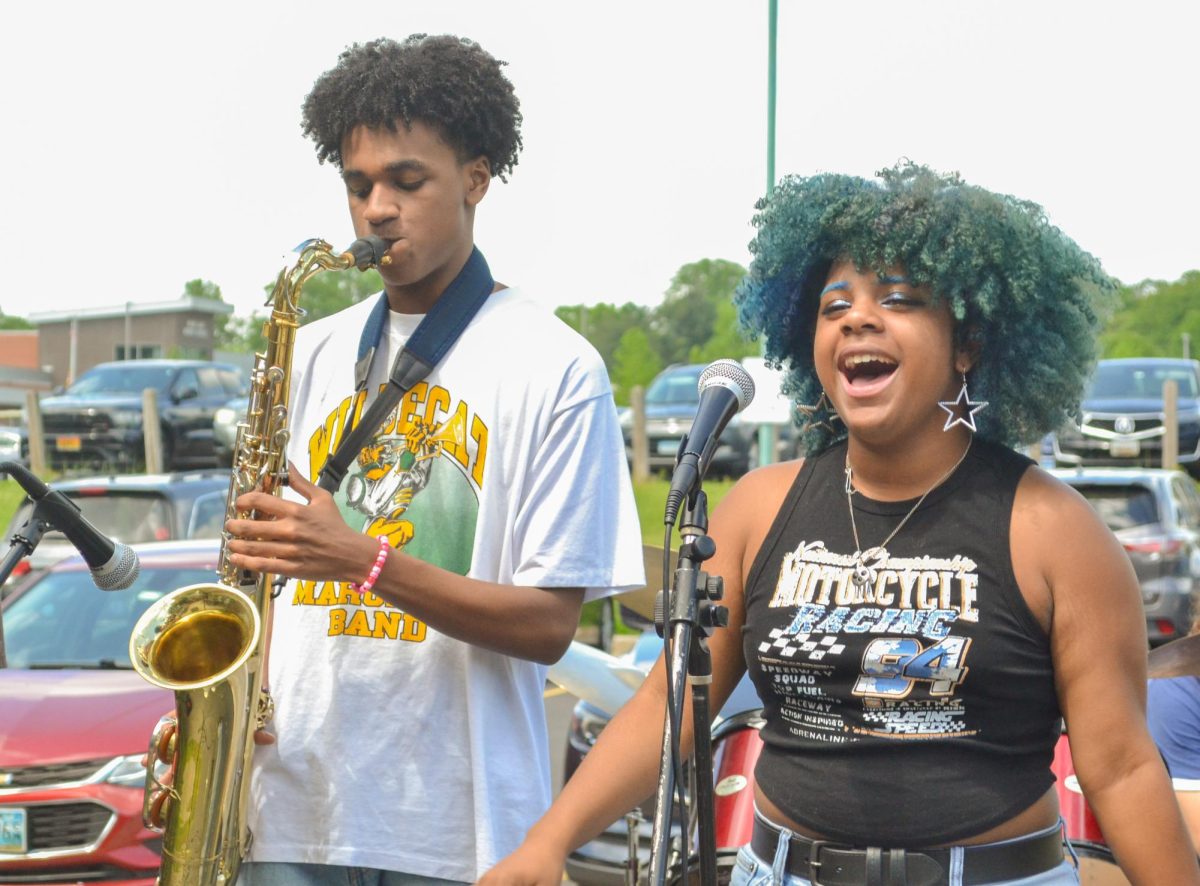 COLUMBIA, MD, MAY 16 - Jay Henry and Oman Speaks perform at May Lunch Jam. Their band, Avenue, started performing together at the end of last year and have continued to appear in all guitar department performance opportunities. 