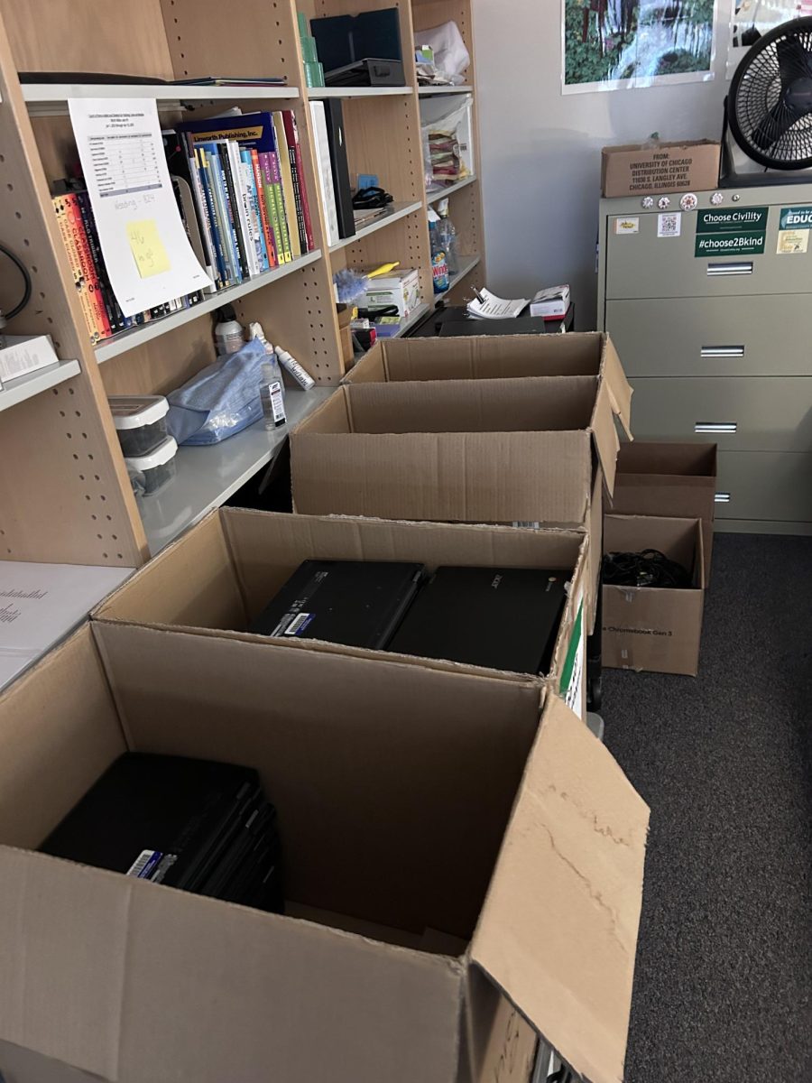 Boxes of Chromebooks returned to the media center by seniors.