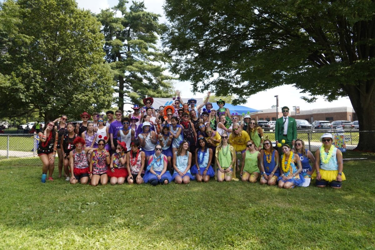 The 2025 CNSL coaching staff gather  together for a group photo at the annual end-of-season All-City Championship Meet.