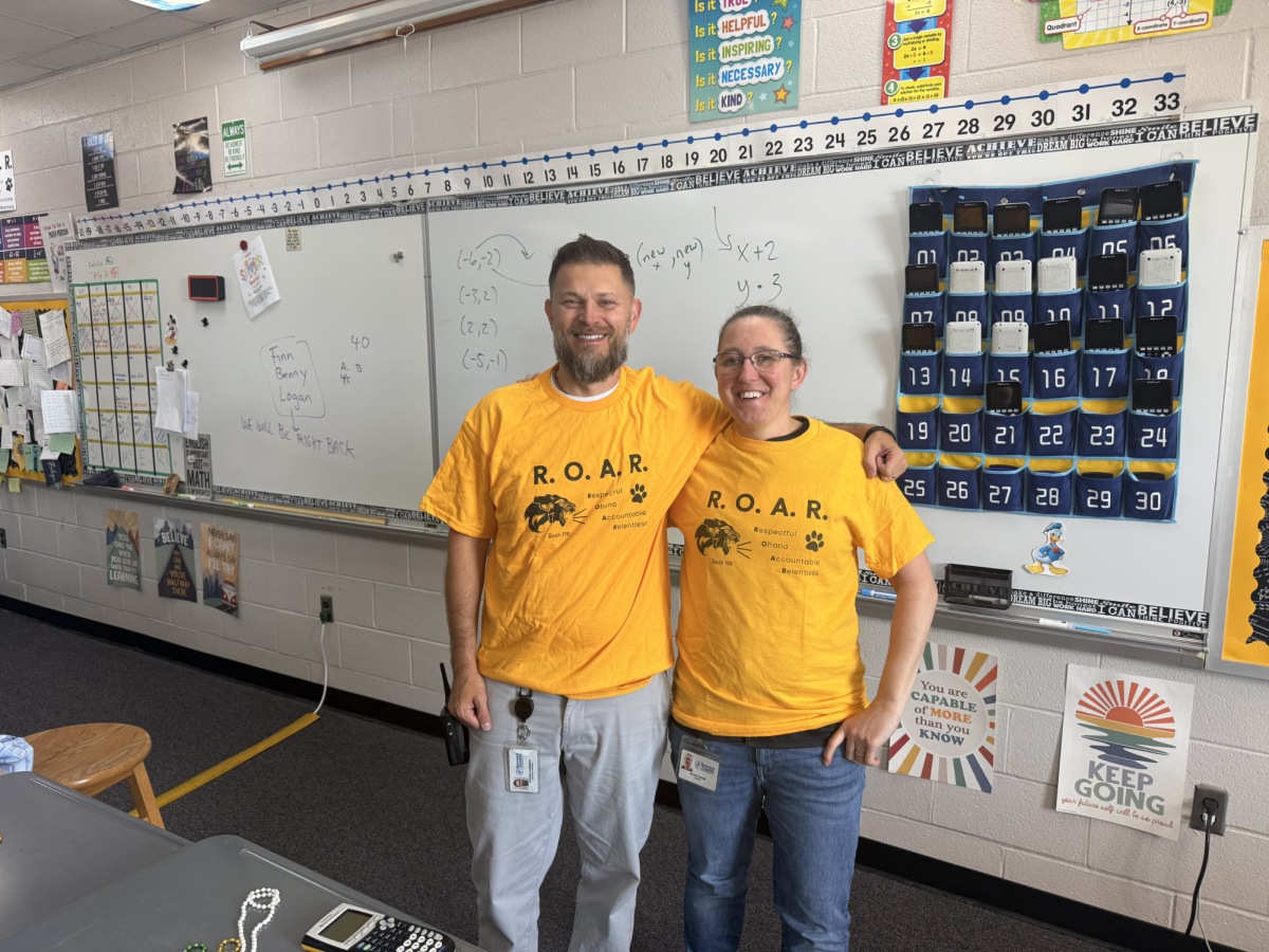 ROAR Sponsors Dr. Dobs and Mrs. Bauer wearing their ROAR shirts!